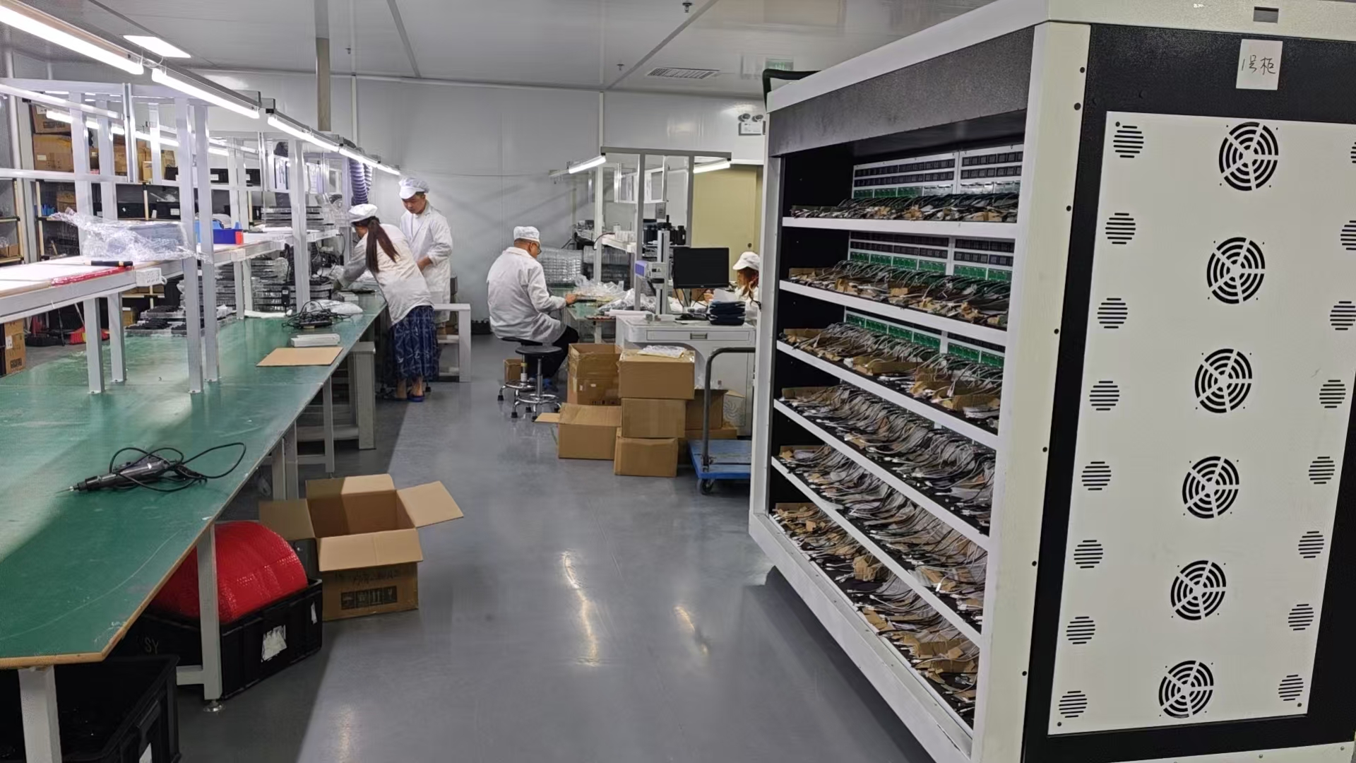 Kwin Electronics assembly workshop with production lines and reliability testing cabinet