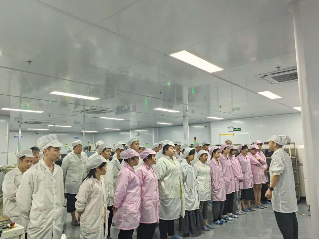 Kwin Electronics factory morning production meeting